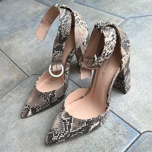 New shoes, multi color ankle strap with a 4”block heel. Snake skin print.